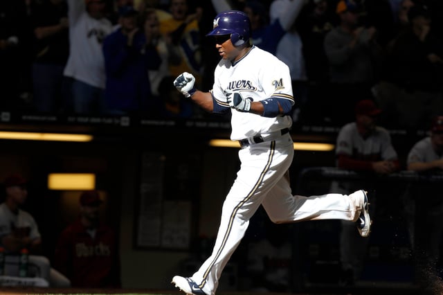 Milwaukee Brewers shortstop Yuniesky Betancourt  scores on a soft singe by Lucroy in the 6th against the  Arizona Diamondbacks  during the National Leaage Divisional Series at Miller Park, Saturday, October 1, 2011.