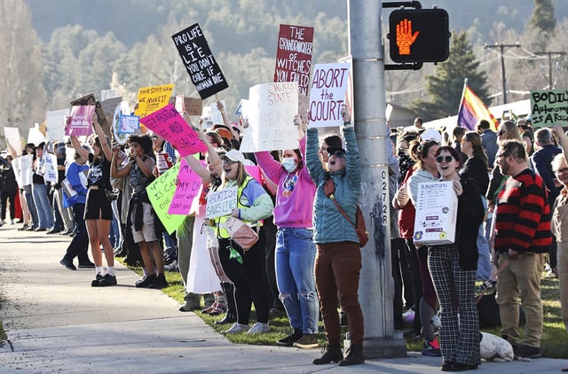 Protesters gather in front of Flagstaff City Hall to protest the new Arizona State Supreme Court ruling on April 12, 2024.