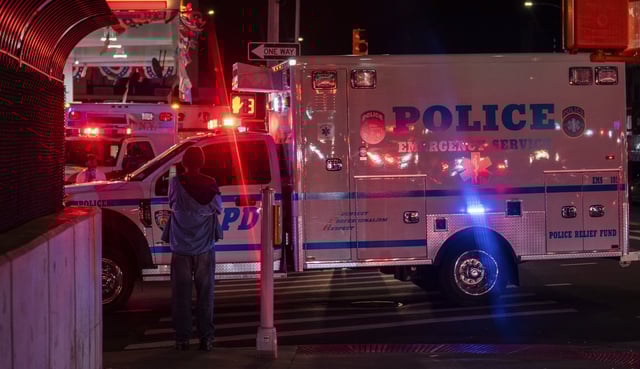 A New York City Police Department ambulance carrying the remains of Officer Jonathan Diller drives out from under Jamaica Hospital Medical Center in New York, late Monday, March 25, 2024. Diller was shot and killed during a traffic stop, Mayor Eric Adams said. (AP Photo/Jeenah Moon)