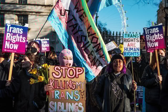 Trans rights activists attend a protest in London on Jan. 21, 2023.
