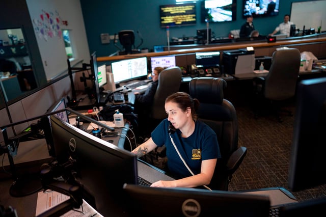 A dispatcher with Anne Arundel County Fire Department  answers a 911 emergency call from their department dispatch center, in Glen Burnie, Md., on April 14, 2020.
