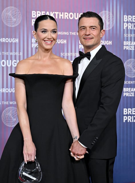 Orlando Bloom, right, opened up about how longtime girlfriend Katy Perry challenges him during an interview with Trevor Noah Thursday.