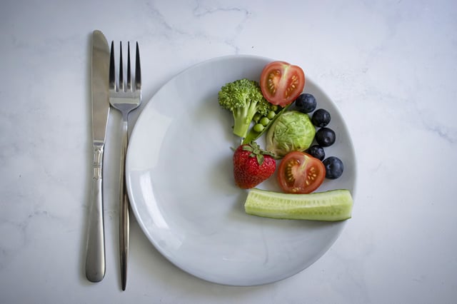 Vegetables and fruits on a plate.