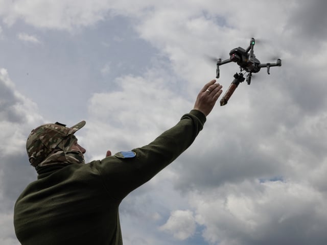 LVIV REGION, UKRAINE - MAY 12: Ukrainian military learn to fly drones with bombs attached at a special school on May 12, 2023 in Lviv region Ukraine. The school is funded by KOLO, a Ukranian foundation running a pilot school of drones and UAV's for the military. Drones are essential in the war effort now for many reasons, instructors are in demand as the effort continues to train more military, police and special forces. (Photo by Paula Bronstein /Getty Images)