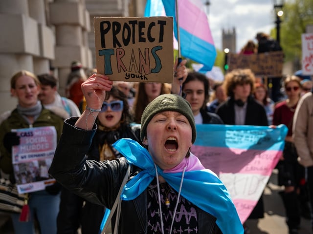 LONDON, ENGLAND - APRIL 20: Trans rights activists take part in a protest against the ban on hormone blockers on April 20, 2024 in London, England. After Dr Hilary Cass delivered her report on NHS gender identity services for children and young people, analysis found most research underpinning clinical guidelines, hormone treatments and puberty blockers to be low quality and the treatments for gender dysphoria have been suspended. The Trans community are protesting against this ban. (Photo by Carl Court/Getty Images)