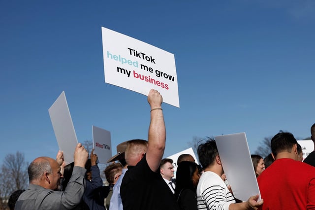 Participants hold signs in support of TikTok outside the US Capitol Building in Washington in March. Photo: Getty Images/AFP