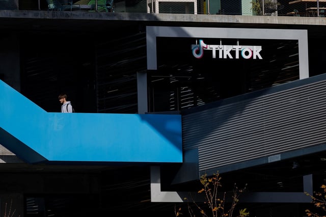A person arrives at the offices of Tik Tok after the U.S. House of Representatives overwhelmingly passed a bill that would give TikTok's Chinese owner ByteDance about six months to divest the U.S. assets of the short-video app or face a ban, in Culver City, California, U.S., March 13, 2024.  REUTERS/Mike Blake

