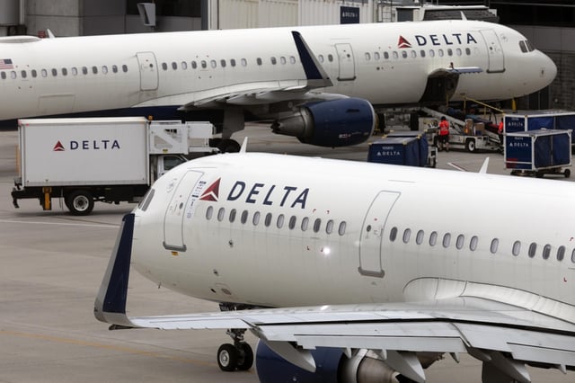 A Delta Air Lines plane leaves the gate on July 12, 2021, at Logan International Airport in Boston. Delta is raising pay for flight attendants and other nonunion workers by 5%. And the airline is boosting starting pay for all its U.S. jobs to at least $19 an hour. Delta CEO Ed Bastian announced the pay raises in a memo Monday, April 22, 2024 to employees. (AP Photo/Michael Dwyer, File)