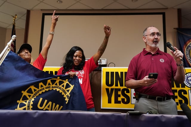 Volkswagen Workers At Chattanooga Hold Unionization Vote. United Auto Workers (UAW) President Shawn Fain, right, speaks as local organizers raise their fists at a UAW vote watch party on April 19, 2024 in Chattanooga, Tennessee. With over 51% of workers voting yes the UAW won the right to form a union at the plant.