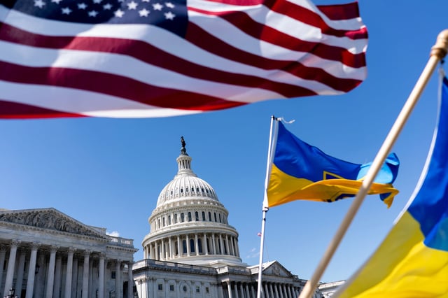 American and Ukrainian flags fly near the US Capitol on April 20, in Washington, DC.