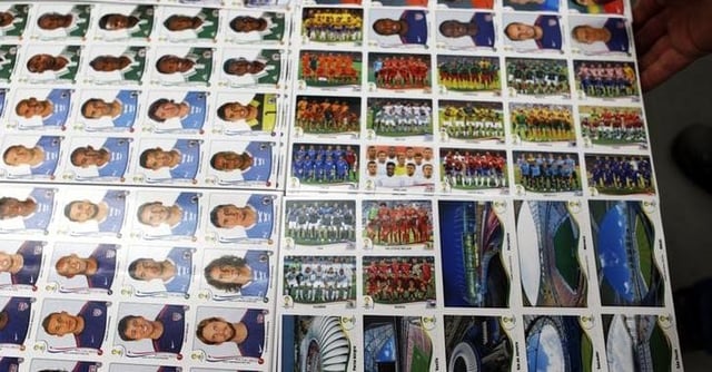 A labourer works at the assembly line of Panini's factory, where FIFA's Brazil World Cup stickers and albums are produced, in Tambore, an industrial suburb north of Sao Paulo May 5, 2014.  The World Cup is around the corner and millions of fans are putting down their iPads to collect and trade soccer stickers, a decades-old hobby that has defied the digital age. Picture taken May 5, 2014.  REUTERS/Paulo Whitaker (BRAZIL - Tags: SPORT SOCCER WORLD CUP SOCIETY BUSINESS)