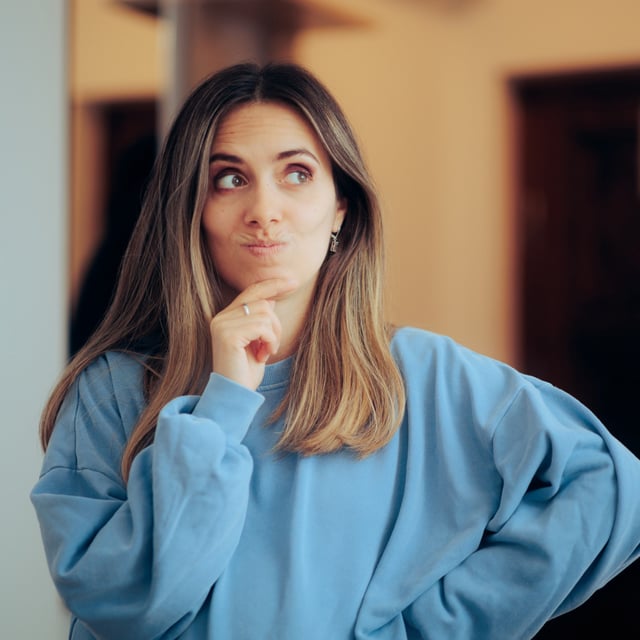 A stock photo shows a woman trying to remember something. Psychologists have said that loosing your keys doesn't always mean you have a poor memory.