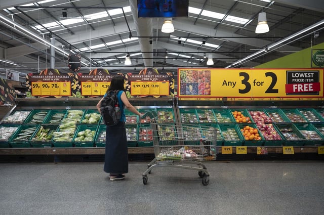 LONDON, UNITED KINGDOM - AUGUST 17: A woman shops at a supermarket while the annual infilation decreases to 6.8 percent, as it was expected in London, United Kingdom on August 17, 2023. According to the Office for National Statistics, the annual inflation decreases to 6.8 percent on July, from 7.9 percent in June, 2023. (Photo by Rasid Necati Aslim/Anadolu Agency via Getty Images)