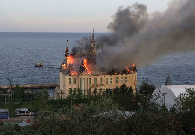 An educational institution known as 'Harry Potter castle' burns after a Russian missile strike in Odesa, Ukraine, on April 29.