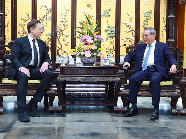 Chinese Premier Li Qiang meets with Elon Musk, CEO of the U.S. electric carmaker Tesla, in Beijing, capital of China, April 28, 2024. (Photo by Wang Ye/Xinhua via Getty Images)