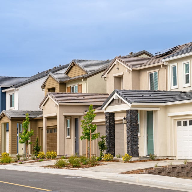 Newly-built row of single family homes.