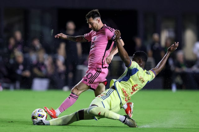 Inter Miami's Argentine forward #10 Lionel Messi fights for the ball with New York's Colombian defender #04 Andres Reyes during the Major League Soccer (MLS) football match between Inter Miami CF and the New York Red Bulls at Chase Stadium in Fort Lauderdale, Florida, on May 4, 2024. (Photo by Chris ARJOON / AFP)