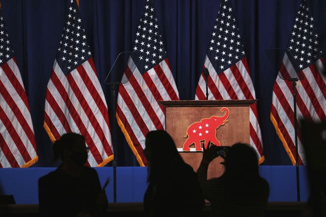 The GOP logo hangs on a podium during the Republican National Convention in Charlotte, North Carolina, U.S., on Monday, Aug. 24, 2020.