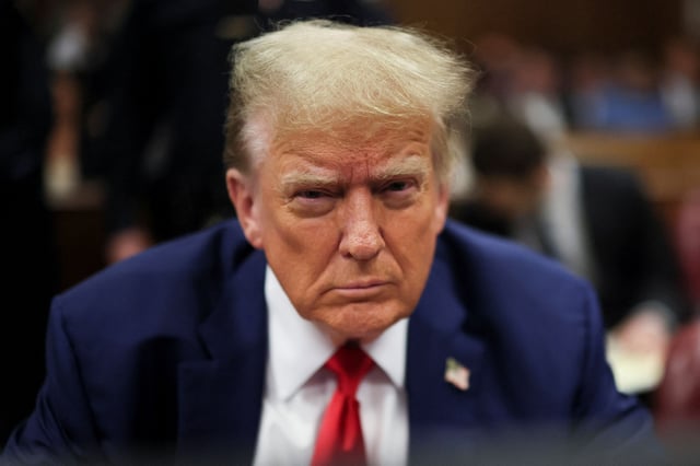 Republican presidential candidate and former U.S. President Donald Trump sits in the courtroom, as his criminal trial over charges that he falsified business records to conceal money paid to silence porn star Stormy Daniels in 2016 continues, at Manhattan state court in New York City, U.S., May 6, 2024. REUTERS/Brendan McDermid/Pool