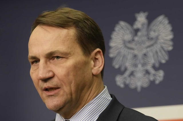 FILE - Poland's Foreign Minister Radek Sikorski addresses reporters at the Foreign Ministry in Warsaw, Poland, Wednesday Feb. 14, 2024. Polish prosecutors opened an investigation Monday, May 6, after a Polish judge fled to the autocratic state of Belarus and asked for protection there. Sikorski described the judge as a traitor.