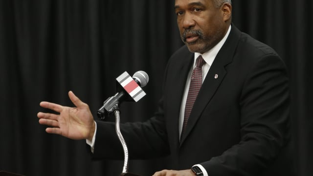 FILE - Ohio State athletics director Gene Smith answers questions during a news conference, Tuesday, Dec. 4, 2018, in Columbus, Ohio. Gene Smith said he'll retire next summer. The 67-year-old Smith, who has spent the past 18 years at Ohio State leading one of the largest and most successful athletic programs in the country, announced Wednesday, Aug. 9, 2023, that he would step down in July 2024. (AP Photo/Jay LaPrete, File)