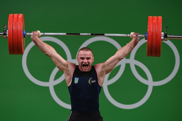Ukraine's Oleksandr Pielieshenko competes during the men's weightlifting 85kg event during the Rio 2016 Olympics Games in Rio de Janeiro on August 12, 2016. / AFP / GOH Chai Hin        (Photo credit should read GOH CHAI HIN/AFP via Getty Images)