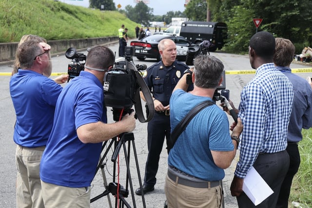 Little Rock Police Lt. Steve McClanahan talks to reporters Monday, Aug, 14, 2017, near the scene of the 42nd homicide of the year in Little Rock, Ark. (AP Photo/Kelly P. Kissel)