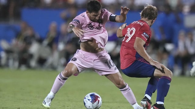 Inter Miami forward Lionel Messi (10) gets around FC Dallas midfielder Paxton Pomykal (19) during the second half of a Leagues Cup soccer match Sunday, Aug. 6, 2023, in Frisco, Texas. (AP Photo/LM Otero)