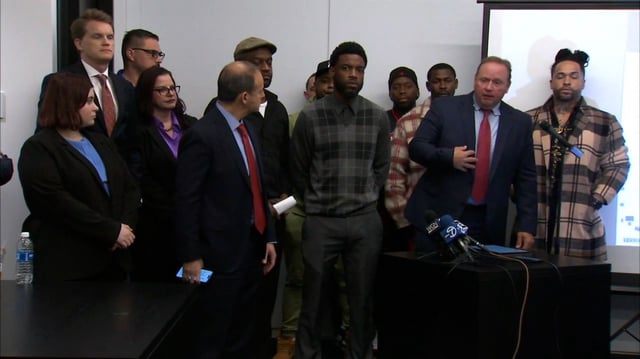 D. Todd Mathews, the lead counsel at the law firm Bailey & Glasser LLP, right, speaks during a press conference with attorneys and abuse survivors on May 7 in Chicago.
