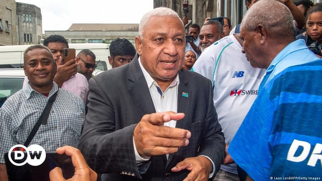 Fiji's former prime minister Frank Bainimarama speaking with his supporters