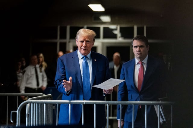 Former President Donald Trump speaks to the media with attorney Todd Blanche as he attends his trial for allegedly covering up hush money payments at Manhattan Criminal Court on May 9, 2024, in New York City.