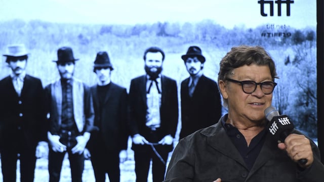 FILE - Robbie Robertson speaks during a press conference for "Once Were Brothers: Robbie Robertson and The Band" on day one of the Toronto International Film Festival on Thursday, Sept. 5, 2019, in Toronto. Robertson, the lead guitarist and songwriter for The Band, whose classics include “The Weight,” “Up on Cripple Creek” and “The Night They Drove Old Dixie Down,” has died at 80, according to a statement from his manager. (Photo by Chris Pizzello/Invision/AP, File)