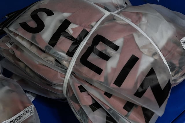 This picture shows signage of cross-border fast fashion e-commerce company SHEIN at a garment factory in Guangzhou, in China's southern Guangdong province on July 18, 2022. (Photo by Jade Gao / AFP) (Photo by JADE GAO/AFP via Getty Images)