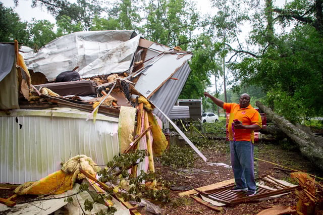 Ed Sutton outside his destroyed trailer in Tallahassee, Fla., on Monday. 