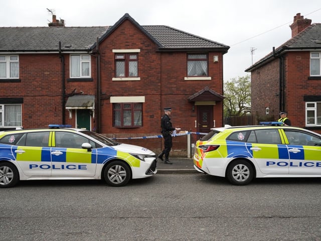 WIGAN - UNITED KINGDOM MAY 09: Police tape cordons off a home in the Abram area of Wigan as police continue anti terrorism investigations on May 09, 2024 in Wigan, United Kingdom. Police conducted a series of raids yesterday evening issuing "planned warrants as part of an ongoing counter terrorism," according to the assistant chief constable of Greater Manchester Police. Three men were taken into custody. (Photo by Christopher Furlong/Getty Images)