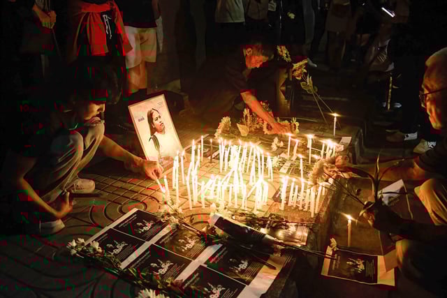 Pro-democracy protesters light candles during a mourning ceremony for Netiporn Sanesangkhom, a Thai political activist, outside The Southern Bangkok Criminal Court on May 14, 2024. Sanesangkhom died from cardiac arrest at after 65 days on hunger strike in prison.