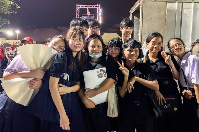 In this September 2020 photo, Netiporn "Bung" Sanesangkhom, center, poses for photographs with members of the "Bad Student" group during a protest against Thailand's government in Bangkok, Thailand on September 19, 2020.