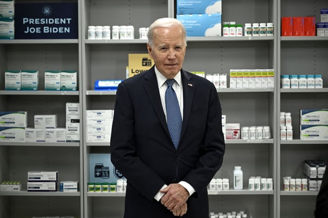 President Joe Biden listens to a speaker talking about lowering prescription drug costs at the National Institutes of Health in December.