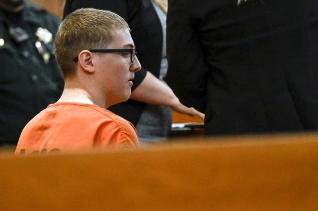 FILE - Defendant Nicholas "Mitch" Karol-Chik listens to District Court Judge Christopher C. Zenisek during an arraignment in Jefferson County District Court, May 3, 2023, in Golden, Colo. Karol-Chik pleaded guilty on Wednesday, May 15, 2024, in the death of Alexis Bartell, a 20-year-old driver who was hit in the head by a rock that crashed through her windshield in suburban Denver last year. (AAron Ontiveroz/The Denver Post via AP, File)