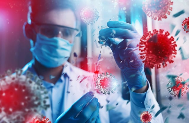 A scientist in a mask holds a test tube with enlarged depictions of COVID-19 across the image
