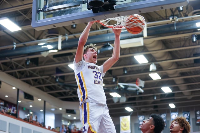 Cooper Flagg dunks the ball during a Montverde Academy basketball game.