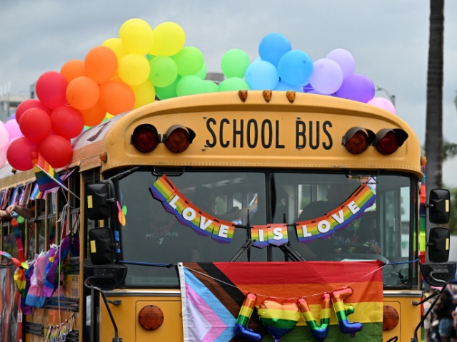 school bus adorned with rainbow colors is the YMCA entry to the 2023 LA Pride Parade on June 11, 2023 in Hollywood, California. The LA Pride Parade marks the last day of the three-day Los Angeles celebration of lesbian, gay, bisexual, transgender, and queer (LGBTQ) social and self-acceptance, achievements, legal rights, and pride. (Photo by Robyn Beck / AFP) (Photo by ROBYN BECK/AFP via Getty Images)