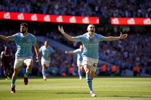 Manchester City's Phil Foden, right, celebrates after scoring his side's opening goal during the English Premier League soccer match between Manchester City and West Ham United at the Etihad Stadium in Manchester, England, Sunday, May 19, 2024.