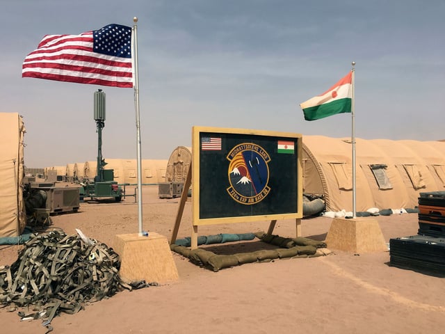 A U.S. and Niger flag are raised side by side at the base camp for air forces and other personnel supporting the construction of Niger Air Base 201 in Agadez, Niger, April 16, 2018. The United States is attempting to create a new military agreement with Niger that would allow it to remain in the country, weeks after the junta said its presence was no longer justified, two Western officials told The Associated Press Friday April 19, 2024.