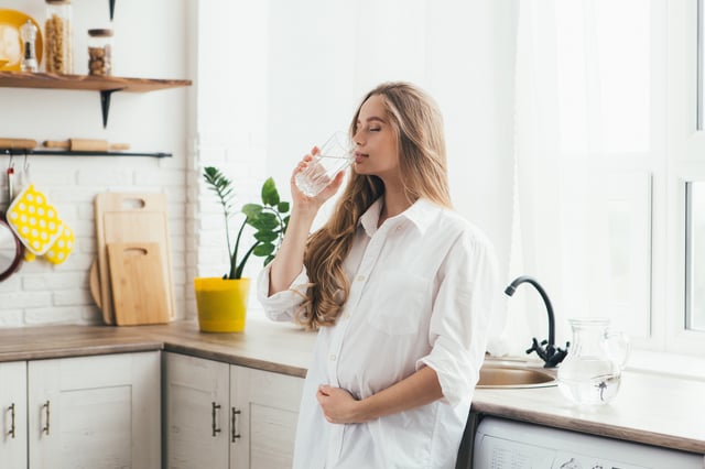 Pregnant woman drinking water