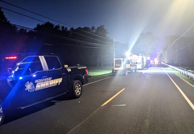 A Clinton County Sheriff's Office truck is shown May 18, 2024, parked near the incident command post near the Michigan scene where a hit-and-run driver struck 16 related pedestrians, killing two.