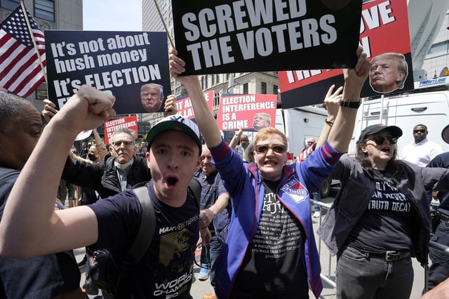 Anti-Trump protesters demonstrate outside Manhattan Criminal Court on May 21, 2024.