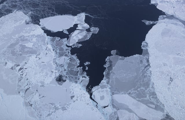 IN FLIGHT, GREENLAND - MARCH 30: Sea ice is seen from NASA's Operation IceBridge research aircraft off the northwest coast on March 30, 2017 above Greenland. NASA's Operation IceBridge has been studying how polar ice has evolved over the past nine years and is currently flying a set of eight-hour research flights over ice sheets and the Arctic Ocean to monitor Arctic ice loss aboard a retrofitted 1966 Lockheed P-3 aircraft. According to NASA scientists and the National Snow and Ice Data Center (NSIDC), sea ice in the Arctic appears to have reached its lowest maximum wintertime extent ever recorded on March 7. Scientists have said the Arctic has been one of the regions hardest hit by climate change. (Photo by Mario Tama/Getty Images)