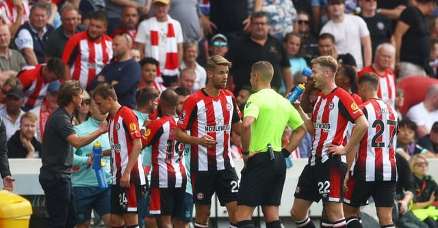 Soccer Football - Premier League - Brentford v Tottenham Hotspur - Brentford Community Stadium, London, Britain - August 13, 2023 Brentford's Kristoffer Ajer speaks to referee Robert Jones Action Images via Reuters/Paul Childs