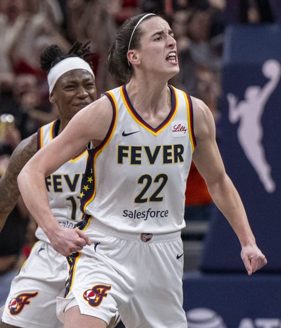 Caitlin Clark reacts after scoring a 3-point basket against the Connecticut Sun at Gainbridge Fieldhouse. The Sun won the game, 88-84.